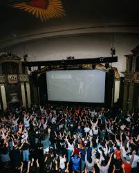 indoor crowd watching video